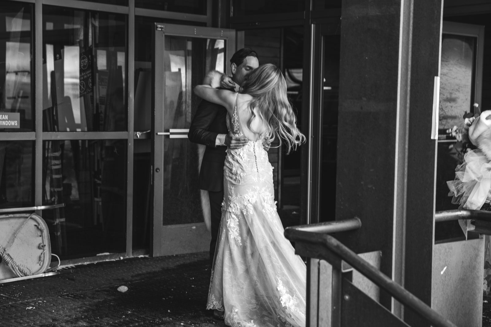 Bride embraces, kisses groom after ceremony