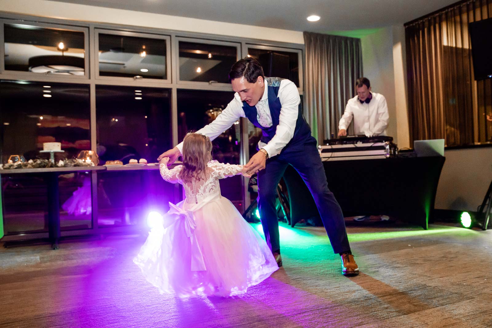 Groom dances with his young daughter